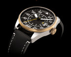 Wristwatch with black dial and black strap on a black background