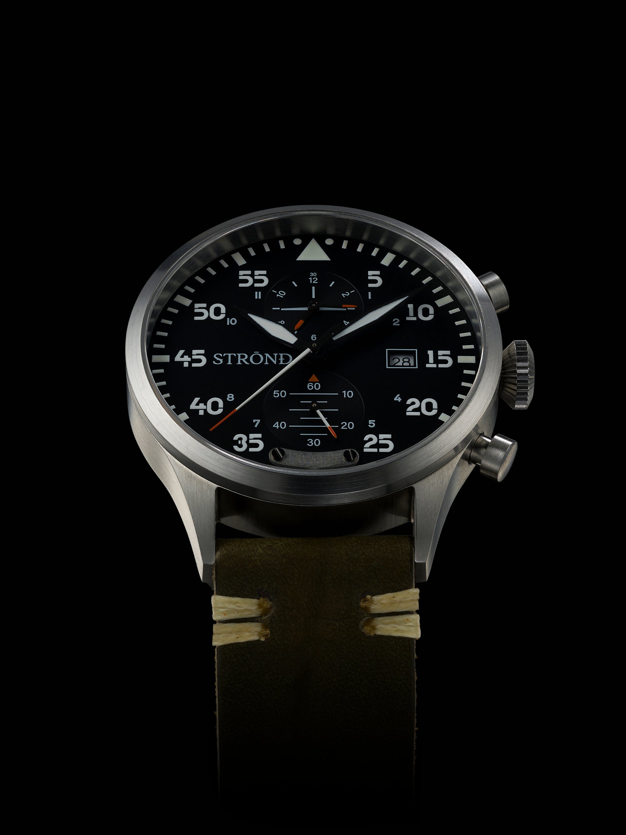 Wristwatch with detailed face on a black background