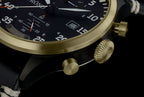 Close-up of a luxurious watch with gold and black design on a dark background