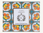 "Casa Amalfi Summer in Sorrento Gift Box featuring a 150g vegan orange, lemon & spices soap and a hand-painted ceramic soap dish from Vietri Sul Mare, inspired by the Amalfi Coast and presented in a glossy maiolica design."