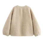 Beige fluffy sweater on a white background