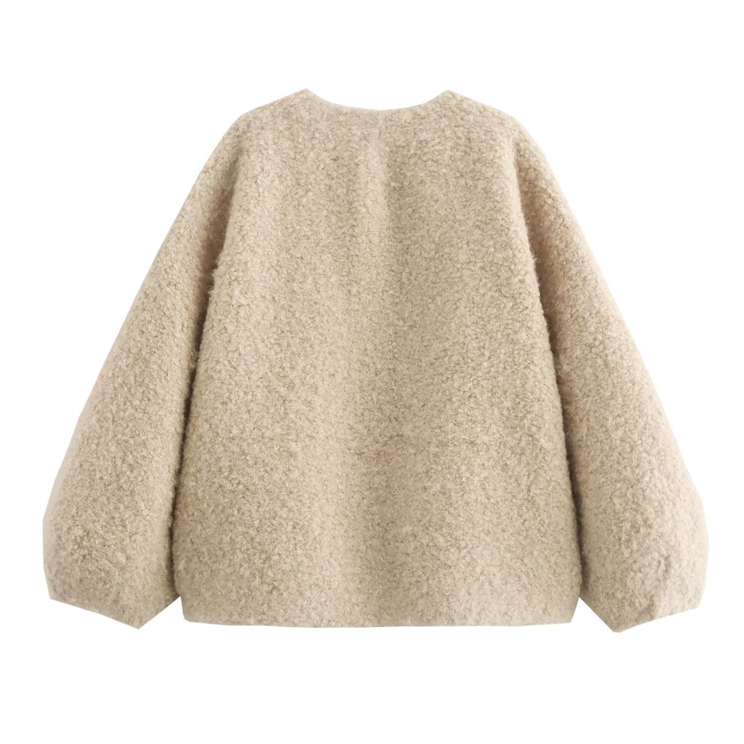 Beige fluffy sweater on a white background