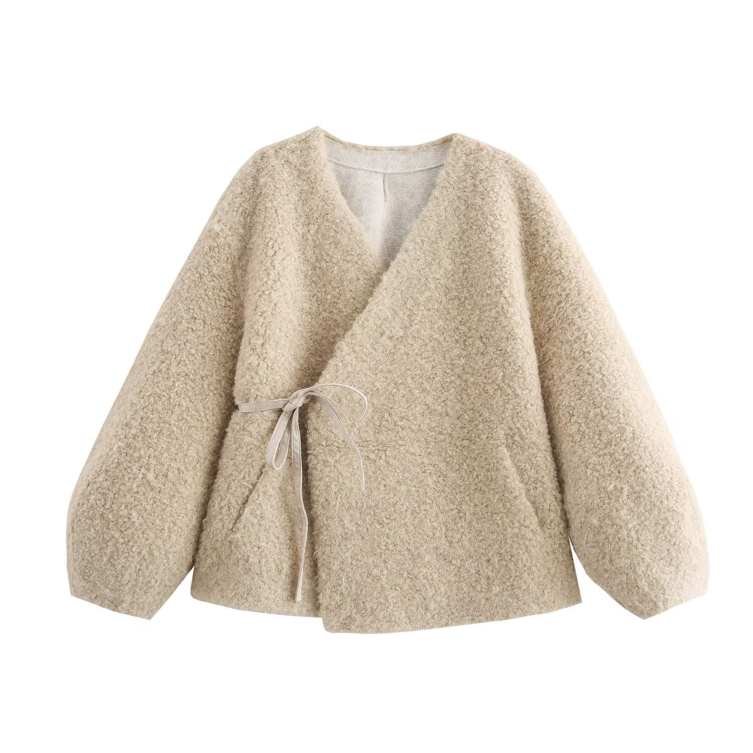 Beige cardigan with a tie detail on a white background