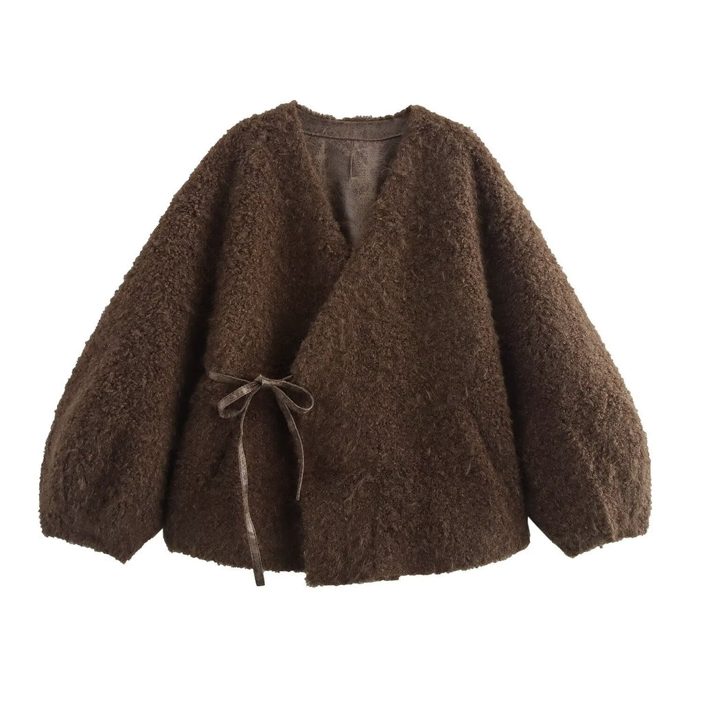 Brown textured cardigan with a tie detail on a white background