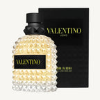 "Valentino Uomo Born in Roma Yellow Dream 3.4 oz Eau de Toilette Spray for men – a vibrant, spicy-woody fragrance with notes of pineapple, mandarin, gingerbread, and cedarwood, in a studded yellow-accented bottle."