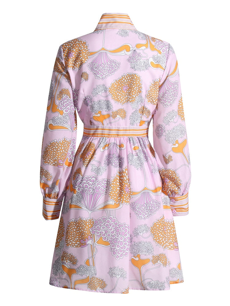 Pink dress with floral pattern on a white background
