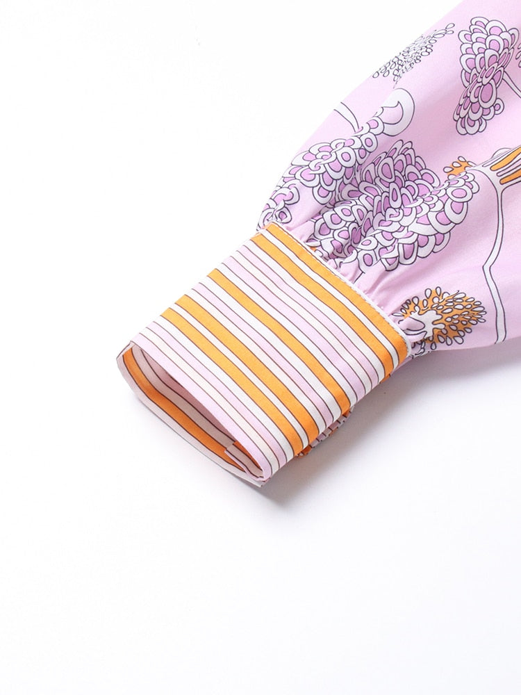 Golf club head cover with floral design and yellow stripes on a white background