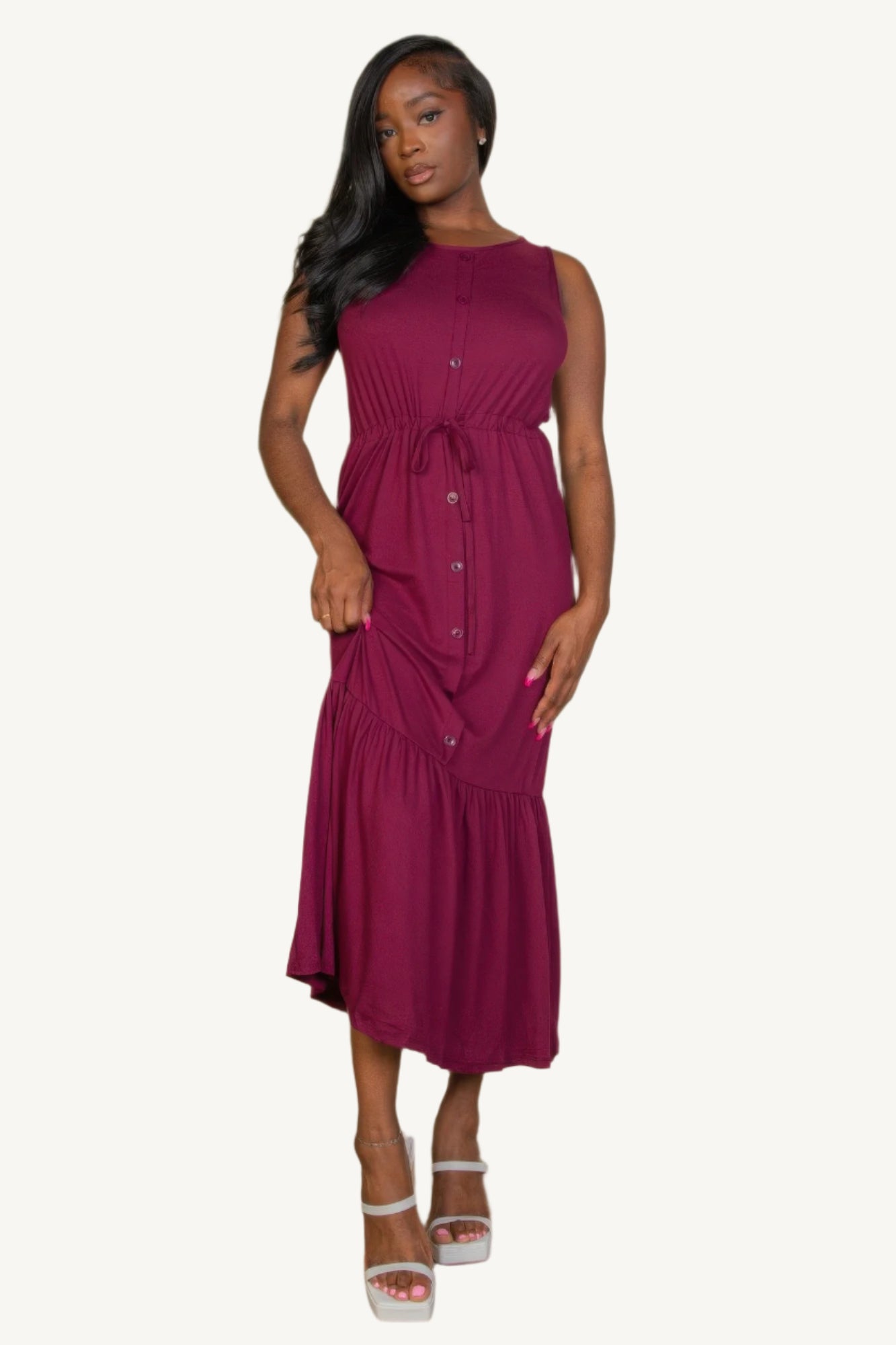 "Sleeveless jersey maxi dress with button front and tie waist – lightweight, stretchy fabric for a flattering, relaxed summer look."