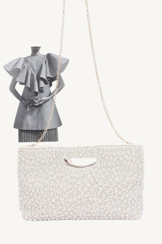 "Handmade faux pearl clutch – elegant evening accessory with detailed craftsmanship for special occasions."