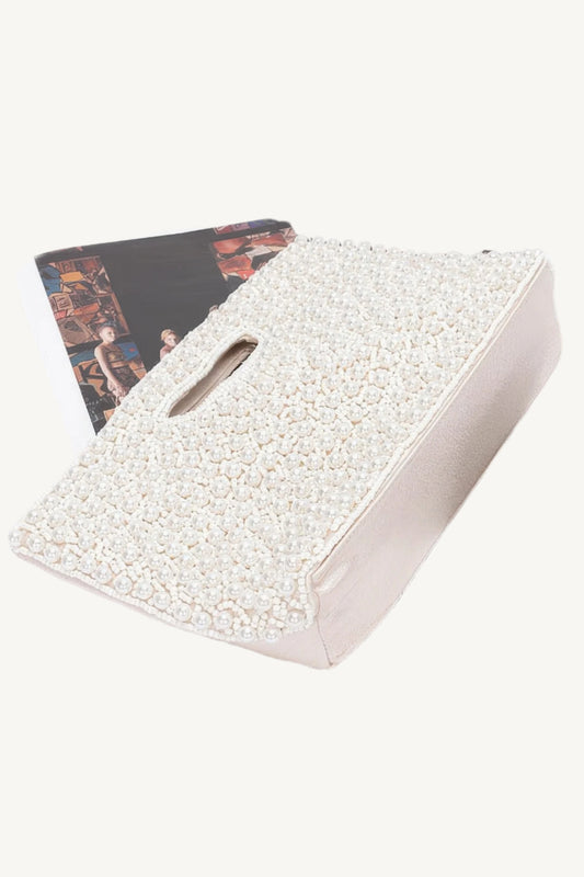 "Handmade faux pearl clutch – elegant evening accessory with detailed craftsmanship for special occasions."