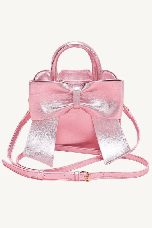 "Metallic top handle clutch with bow front – elegant yet playful accessory for stylish occasions."