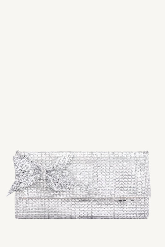 Structured evening clutch covered in rhinestones with a rhinestone bow accent, metal frame, and clasp closure – elegant, compact, and perfect for special occasions.