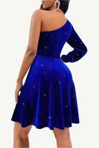 One-shoulder velvet dress with dramatic lantern sleeve and cinched waist, made from a soft, stretchy polyester-elastane blend – elegant, bold, and statement-making.