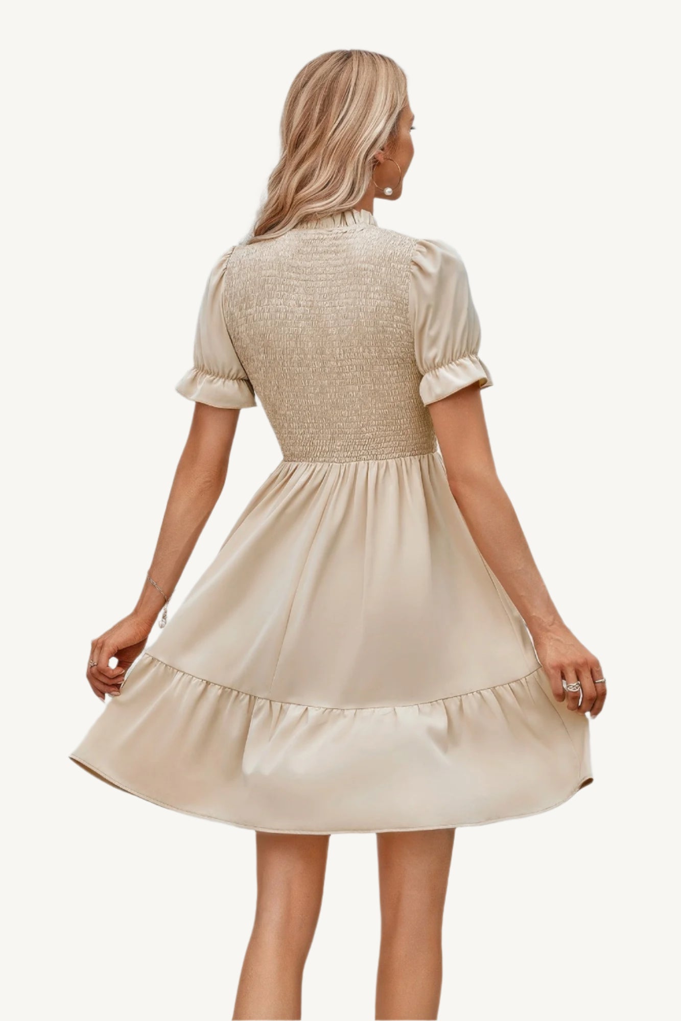 Solid puff sleeve dress with shirred bodice and ruffle hem, made from lightweight polyester – feminine, playful, and perfect for warm-weather days.