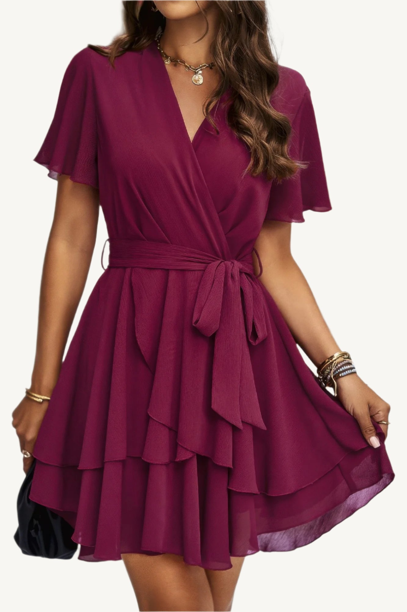 Lightweight chiffon dress with layered hem ruffles and a flattering waist tie – flowy, feminine, and perfect for warm-weather occasions.