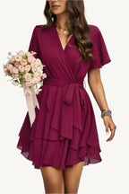 Lightweight chiffon dress with layered hem ruffles and a flattering waist tie – flowy, feminine, and perfect for warm-weather occasions.