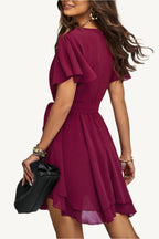 Lightweight chiffon dress with layered hem ruffles and a flattering waist tie – flowy, feminine, and perfect for warm-weather occasions.