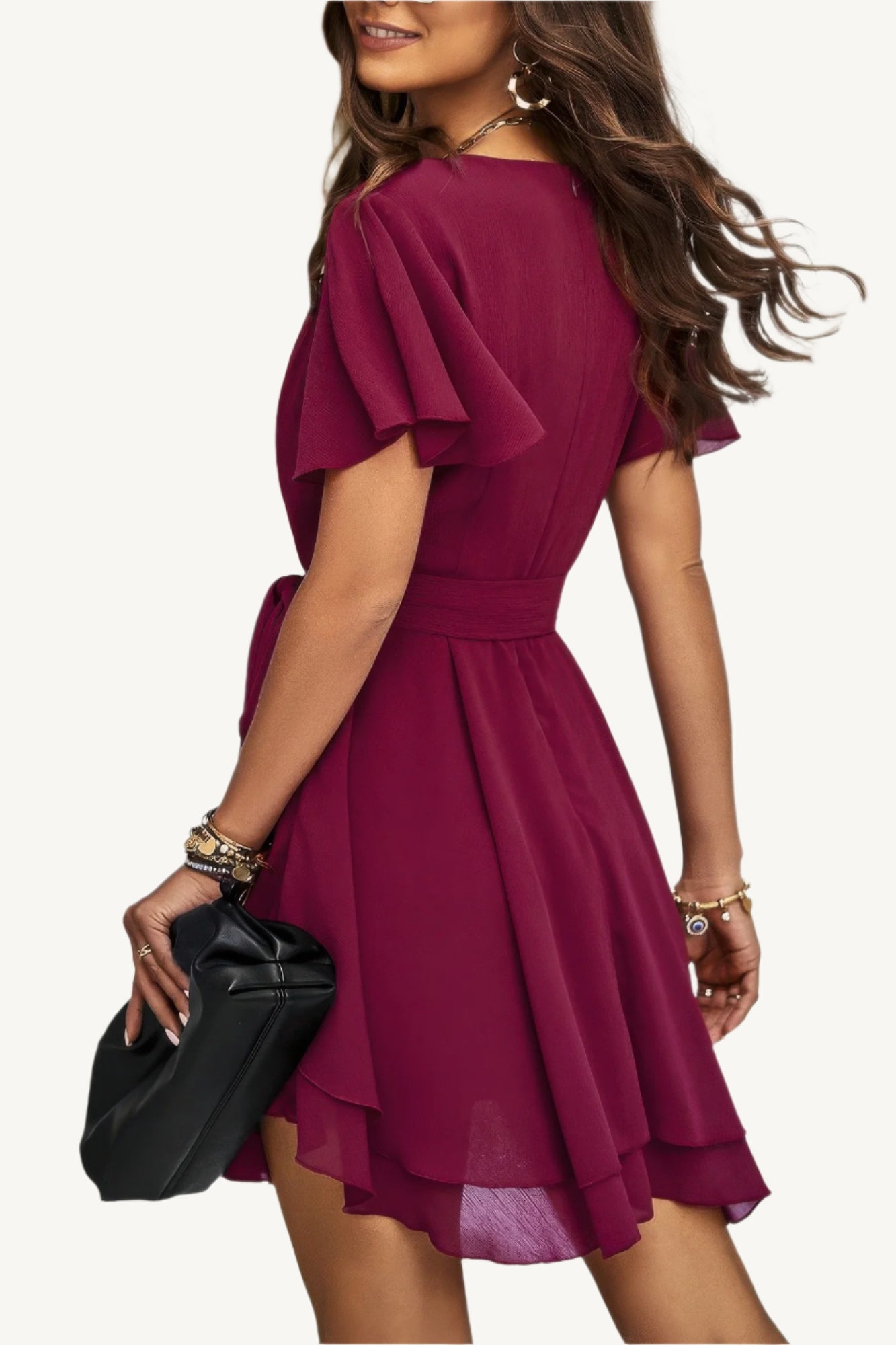 Lightweight chiffon dress with layered hem ruffles and a flattering waist tie – flowy, feminine, and perfect for warm-weather occasions.