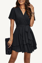 Lightweight chiffon dress with layered hem ruffles and a flattering waist tie – flowy, feminine, and perfect for warm-weather occasions.