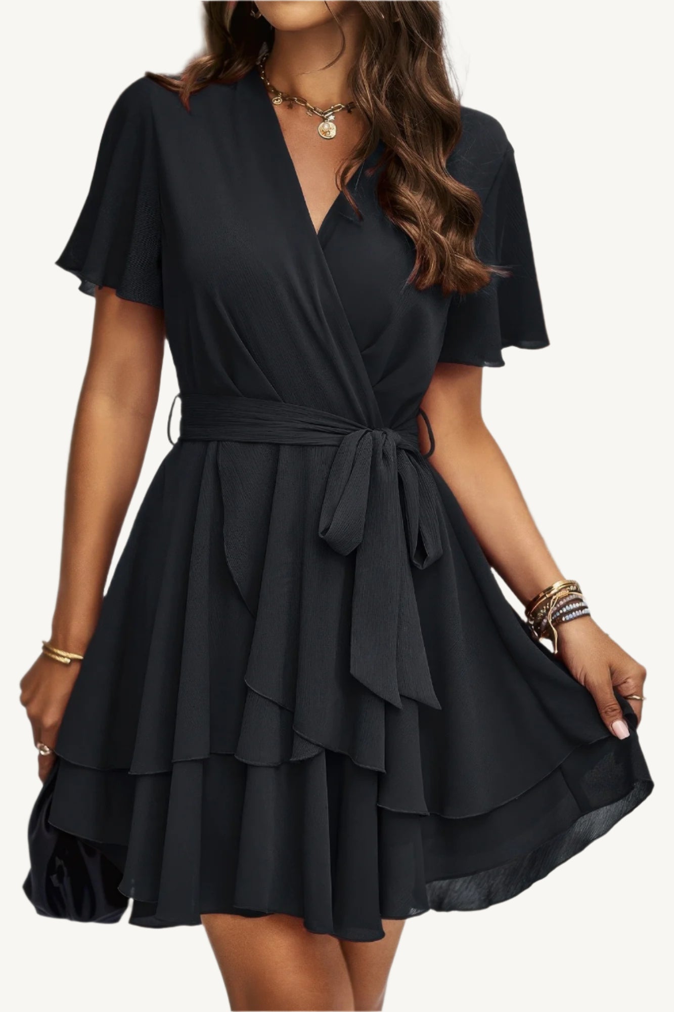 Lightweight chiffon dress with layered hem ruffles and a flattering waist tie – flowy, feminine, and perfect for warm-weather occasions.