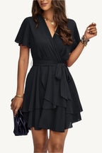 Lightweight chiffon dress with layered hem ruffles and a flattering waist tie – flowy, feminine, and perfect for warm-weather occasions.