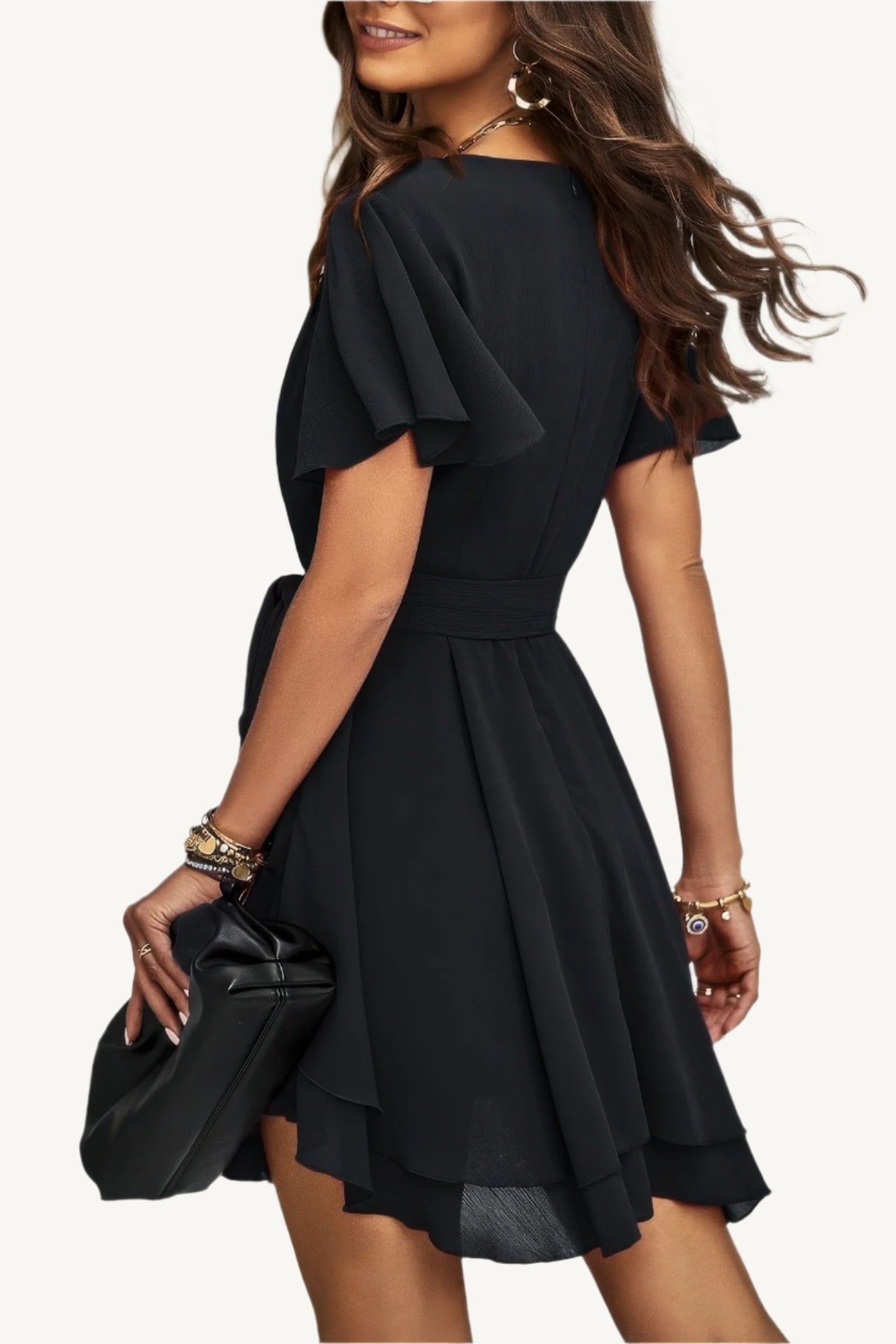 Lightweight chiffon dress with layered hem ruffles and a flattering waist tie – flowy, feminine, and perfect for warm-weather occasions.