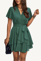Lightweight chiffon dress with layered hem ruffles and a flattering waist tie – flowy, feminine, and perfect for warm-weather occasions.