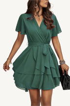 Lightweight chiffon dress with layered hem ruffles and a flattering waist tie – flowy, feminine, and perfect for warm-weather occasions.