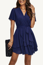 Lightweight chiffon dress with layered hem ruffles and a flattering waist tie – flowy, feminine, and perfect for warm-weather occasions.