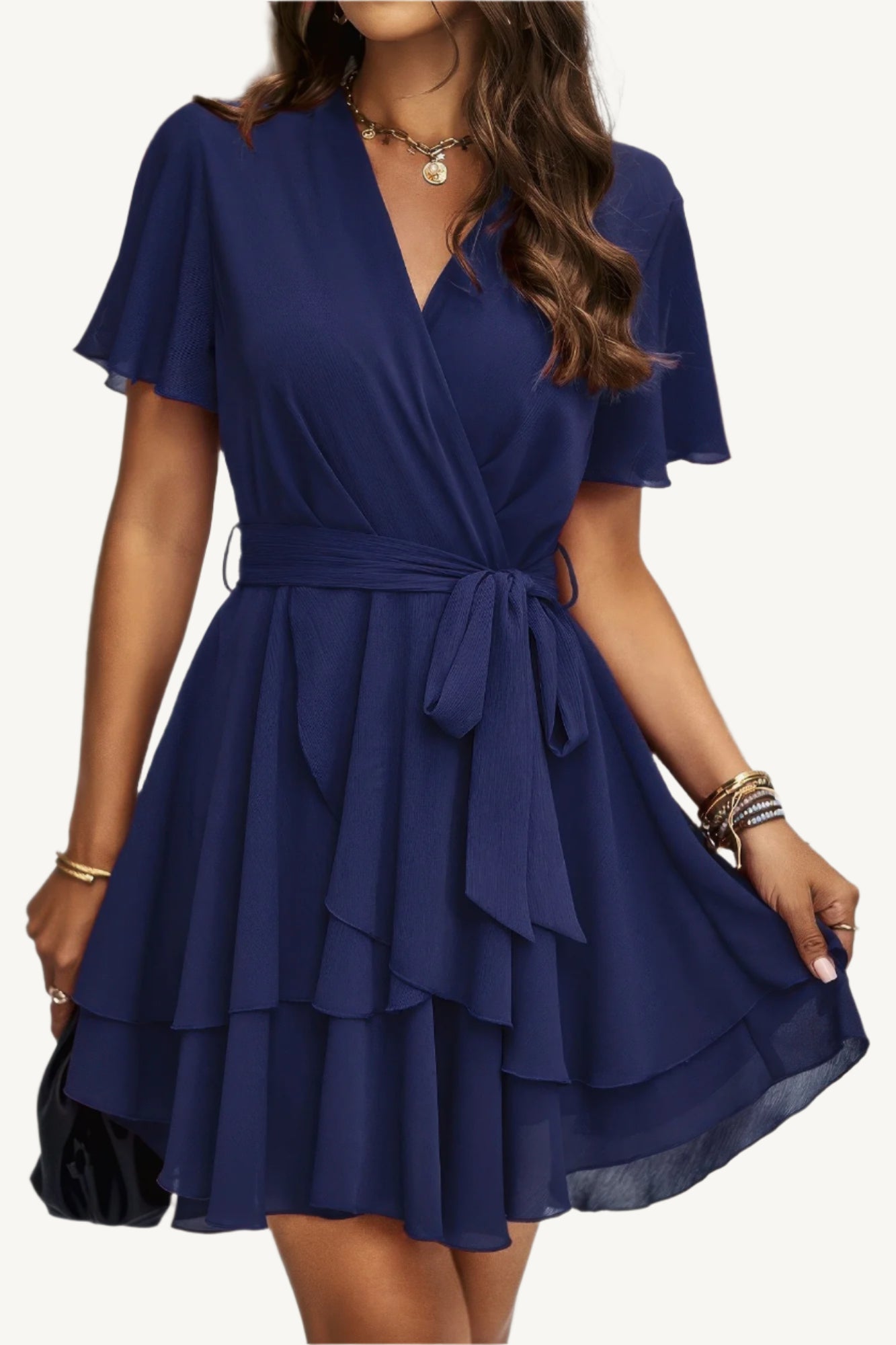 Lightweight chiffon dress with layered hem ruffles and a flattering waist tie – flowy, feminine, and perfect for warm-weather occasions.