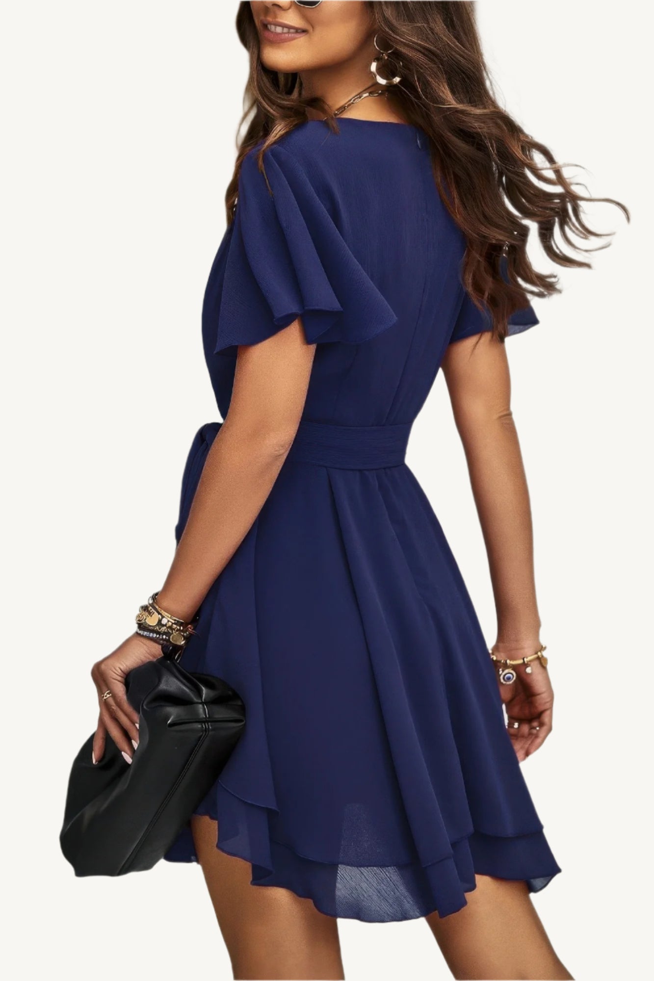 Lightweight chiffon dress with layered hem ruffles and a flattering waist tie – flowy, feminine, and perfect for warm-weather occasions.