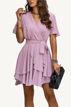 Lightweight chiffon dress with layered hem ruffles and a flattering waist tie – flowy, feminine, and perfect for warm-weather occasions.