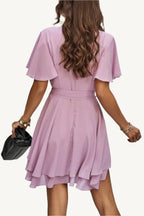 Lightweight chiffon dress with layered hem ruffles and a flattering waist tie – flowy, feminine, and perfect for warm-weather occasions.