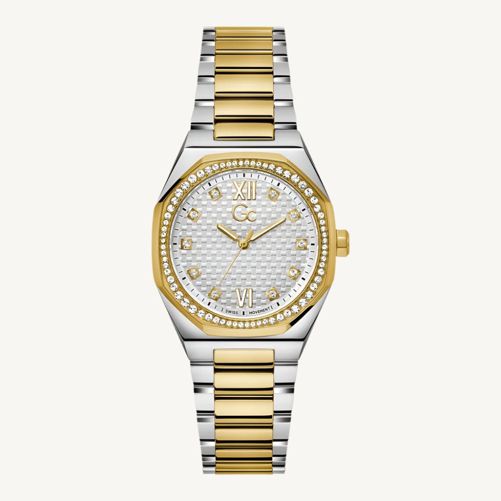 Two-tone silver and gold ladies’ wristwatch with sapphire glass, silver dial, and sparkling stone-set case, featuring Swiss quartz movement and water resistance up to 100 meters.
