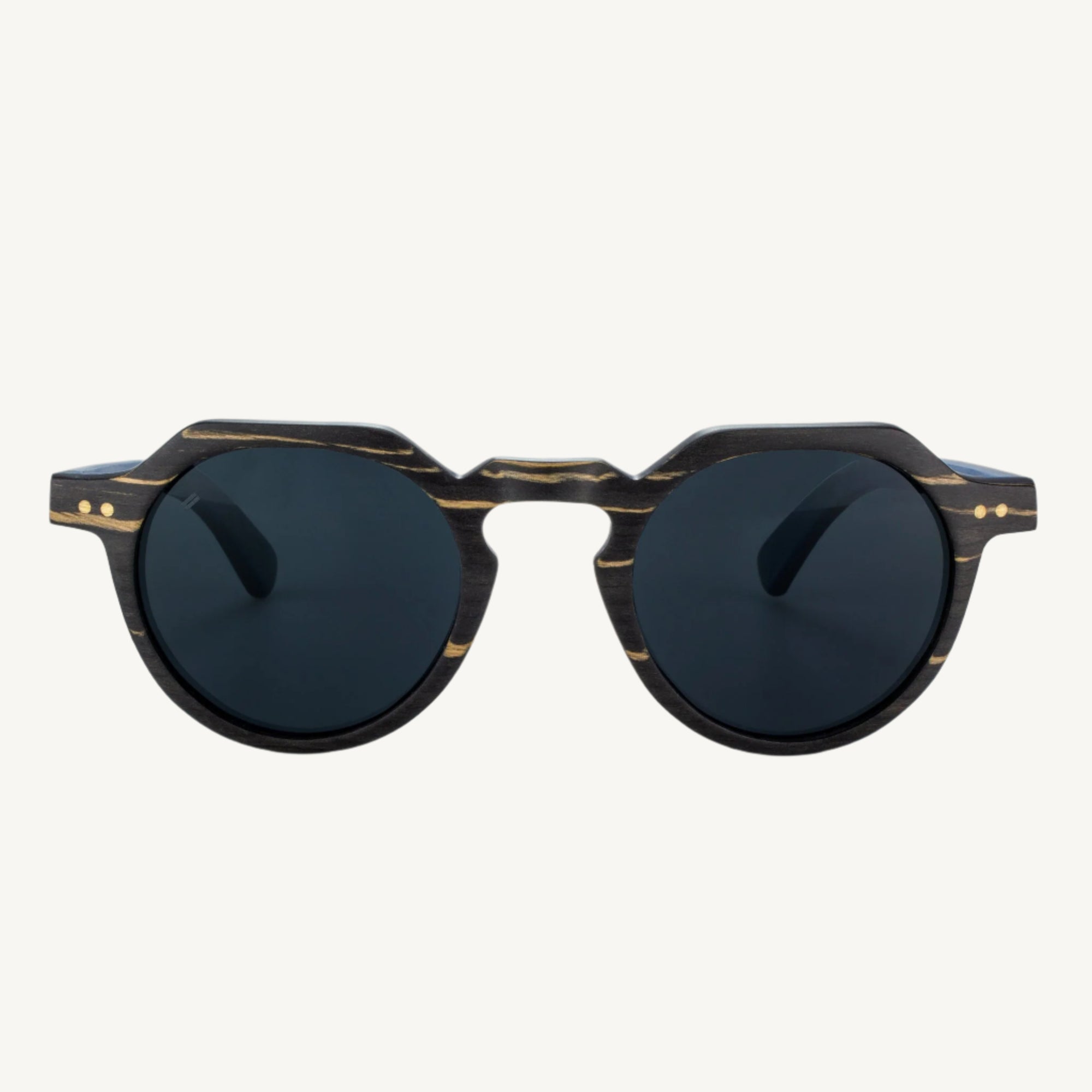 Anna Maria sunglasses — stylish and versatile with dapper round lenses and a soft, subtle keyhole bridge. Perfect for adding a classic touch to any look, whether you're on the go or relaxing in style.
