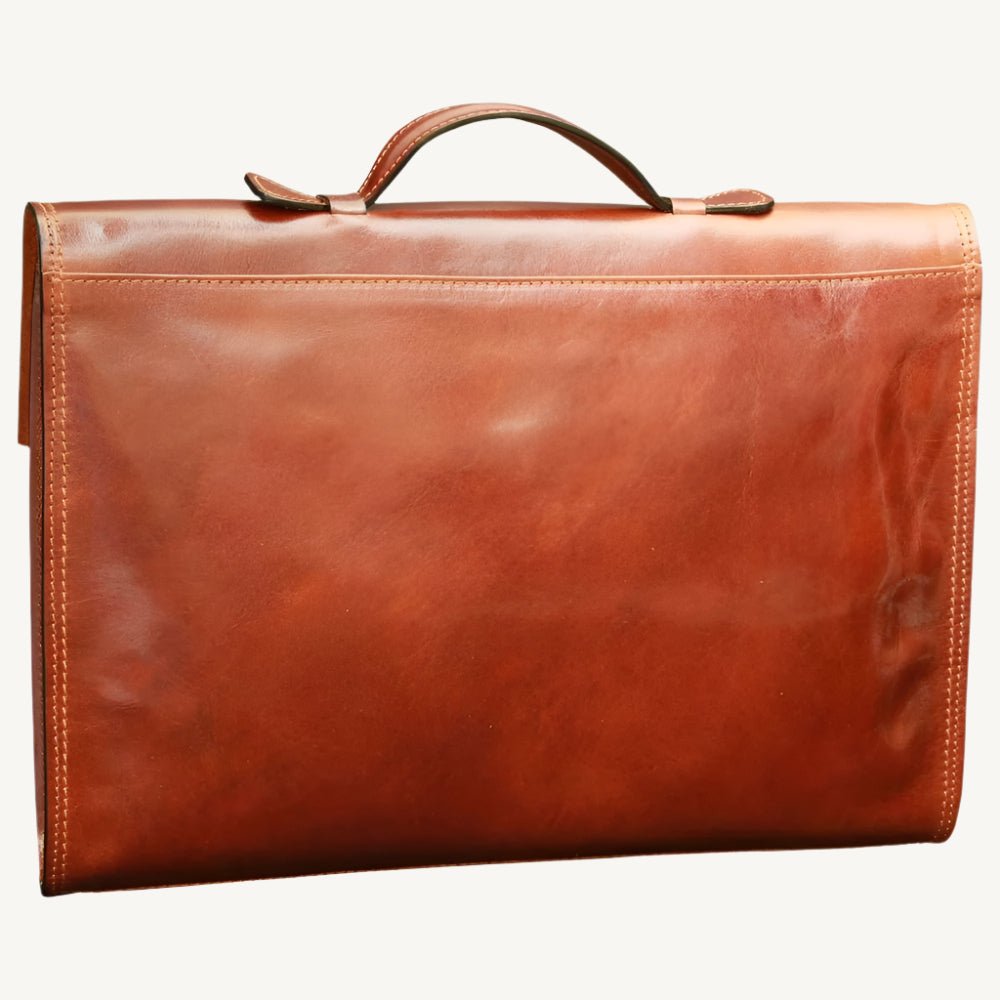 "Slim full-grain calfskin leather briefcase with lock and key closure, synthetic lining, and adjustable leather strap, perfect for modern professionals."