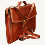 "Slim full-grain calfskin leather briefcase with lock and key closure, synthetic lining, and adjustable leather strap, perfect for modern professionals."