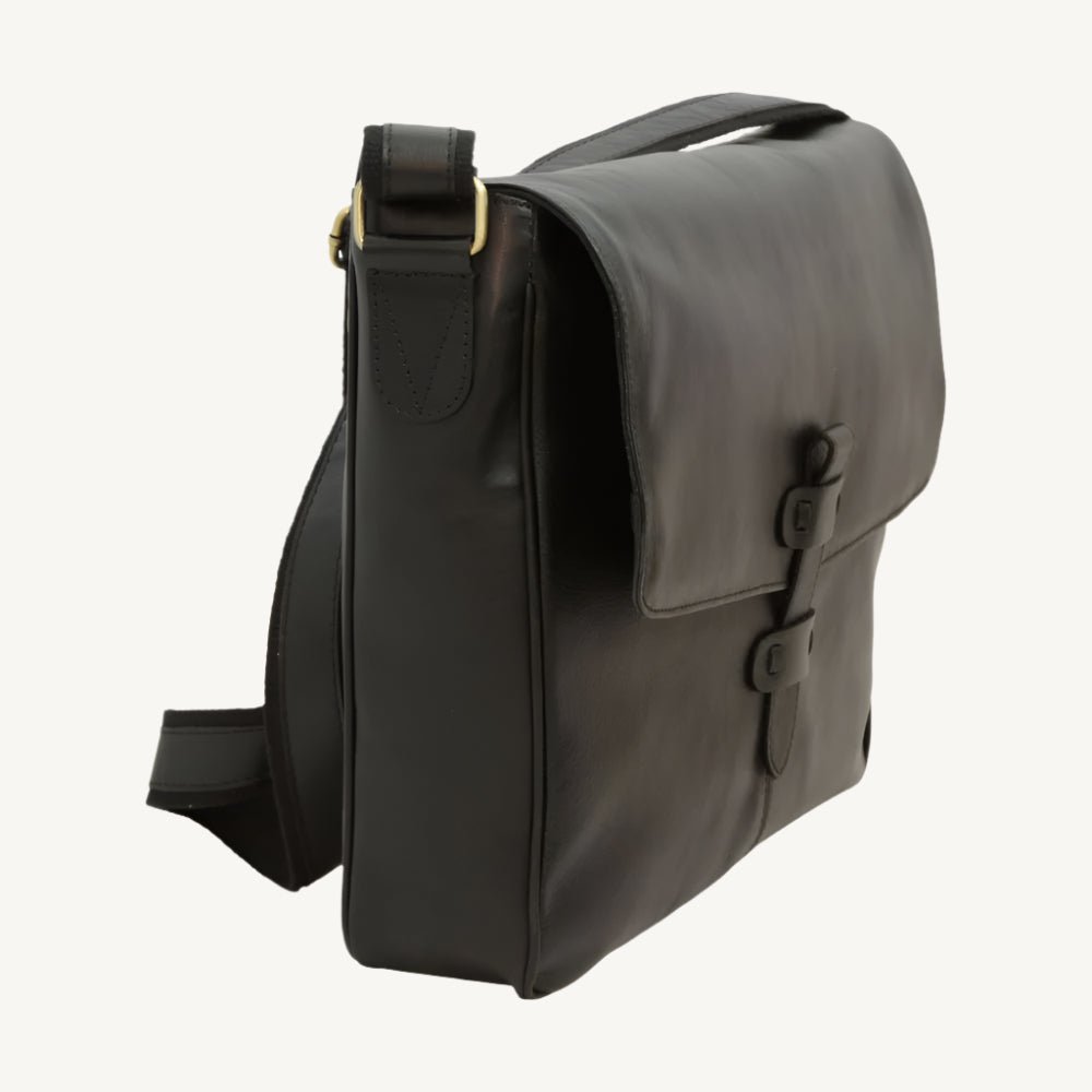 Black cowhide leather messenger bag with adjustable strap and practical inner compartments – sleek and versatile for everyday use.
