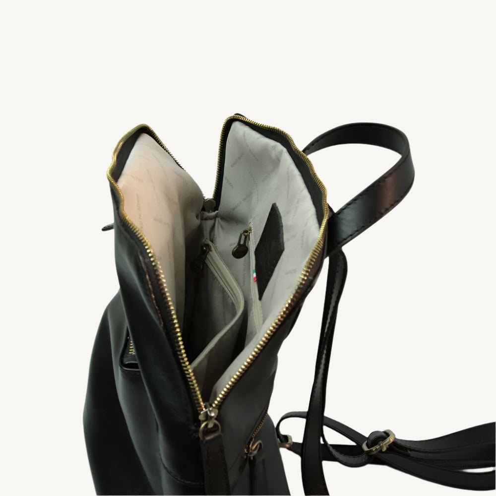 Full grain leather backpack, 30x39x11 cm, featuring “Made in Italy” polyester lining, two compartments, multiple zip pockets, and adjustable shoulder straps.