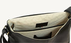 Black cowhide leather messenger bag with adjustable strap and practical inner compartments – sleek and versatile for everyday use.