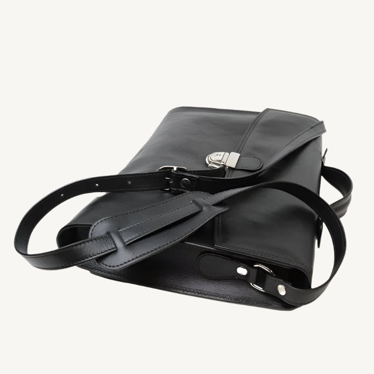 "Slim full-grain calfskin leather briefcase with lock and key closure, synthetic lining, and adjustable shoulder strap, designed for everyday business use."