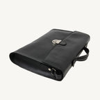 "Slim full-grain calfskin leather briefcase with lock and key closure, synthetic lining, and adjustable shoulder strap, designed for everyday business use."
