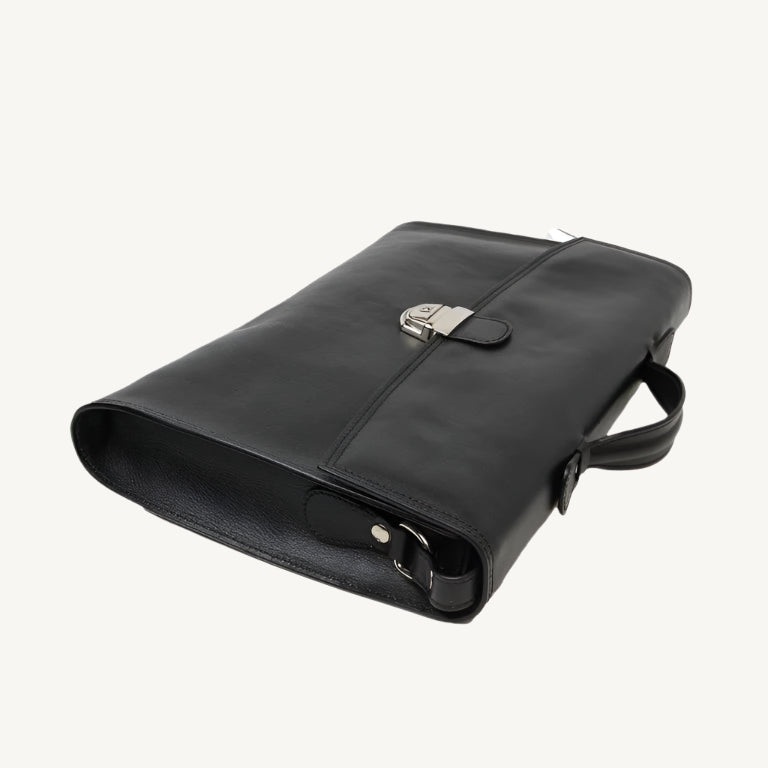 "Slim full-grain calfskin leather briefcase with lock and key closure, synthetic lining, and adjustable shoulder strap, designed for everyday business use."