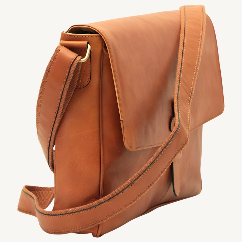 Full-grain calfskin leather messenger bag with padded tablet pocket, adjustable strap, and rear zip pocket – sleek and functional for everyday use.