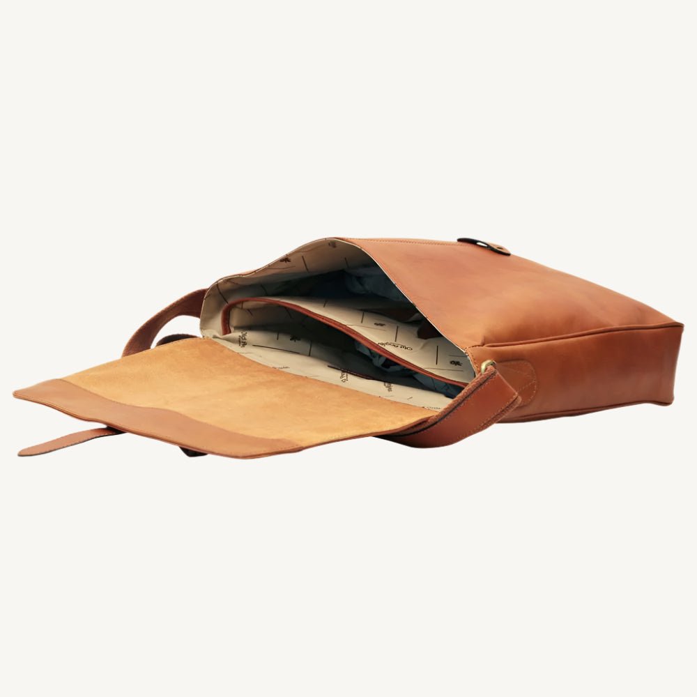 Full-grain calfskin leather messenger bag with padded tablet pocket, adjustable strap, and rear zip pocket – sleek and functional for everyday use.