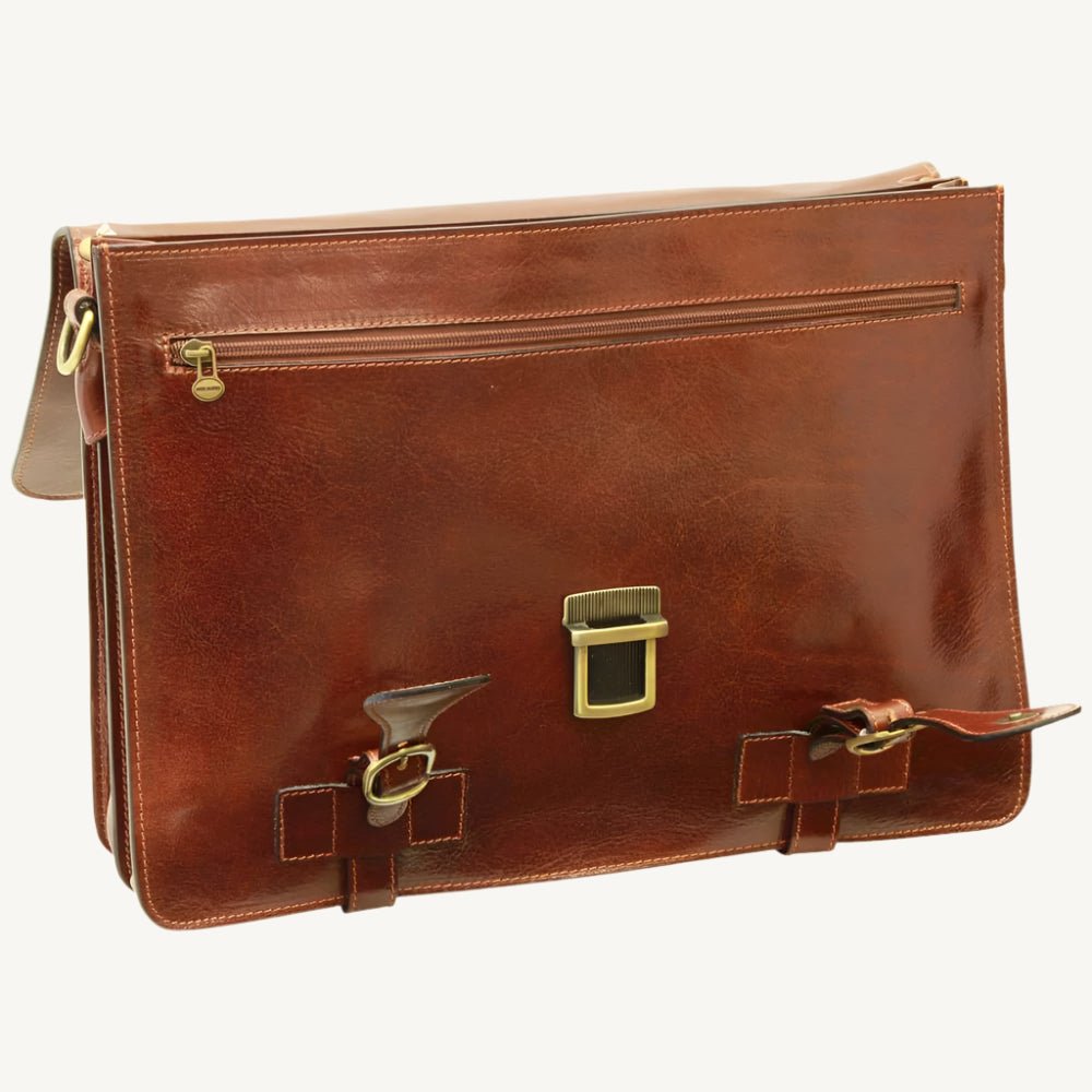Handcrafted Italian brown leather briefcase made from full-grain calfskin, featuring classic buckle straps, flap closure, and interior compartments — elegant and functional for modern professionals.