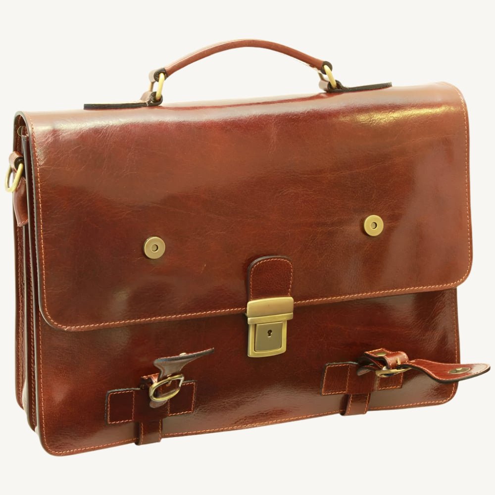 Handcrafted Italian brown leather briefcase made from full-grain calfskin, featuring classic buckle straps, flap closure, and interior compartments — elegant and functional for modern professionals.