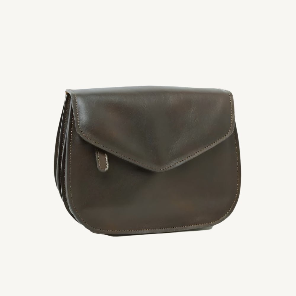 Elegant full-grain calfskin leather shoulder bag with front and back zippered pockets, leather lining, and adjustable strap.