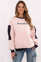 Woman wearing a pink sweatshirt with 'Hoodies' text on a white background
