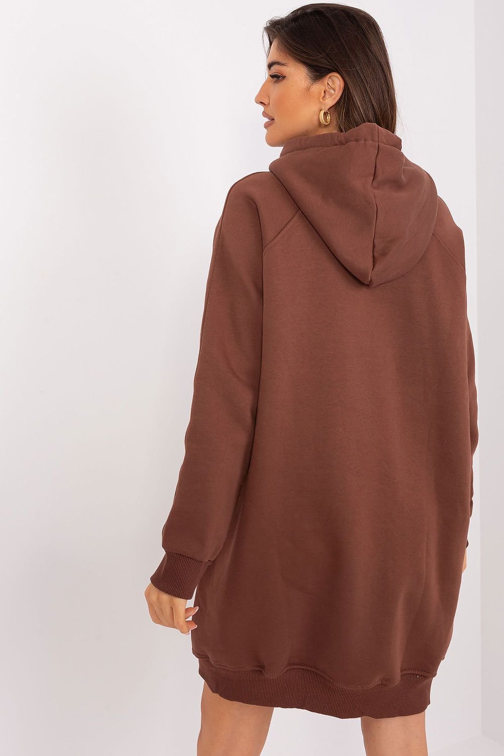 Brown hoodie worn by a person on a white background